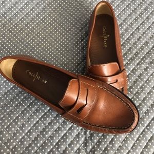 Cole Haan brown leather penny loafers.
